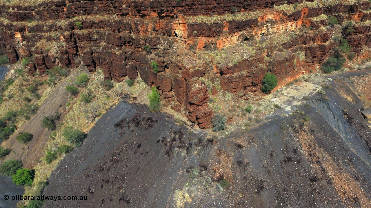 160103 DJI 0067
Colonial Mill and mine ruins located within Wittenoom Gorge. The large concrete area on the upper level is the former mining offices and railway workshops, a sharp eye will see the sealed mine entry with a red door. The tracks for the battery loco charging and maintenance area also stand out. See images of the site intact [url=http://www.pilbararailways.com.au/gallery/thumbnails.php?album=117] here [/url], 194-13 onwards shows the loco area. Geodata: [url=https://goo.gl/maps/sAcWhrFxDDPKBDxQ8]-22.312705, 118.319078[/url].
