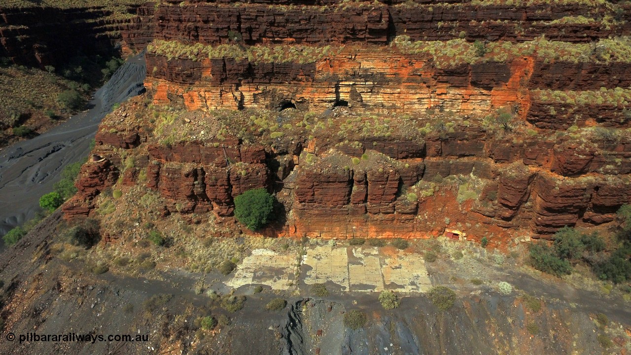 160103 DJI 0069
Colonial Mill and mine ruins located within Wittenoom Gorge. The large concrete area on the upper level is the former mining offices and railway workshops, a sharp eye will see the sealed mine entry with a red door. See images of the site intact [url=http://www.pilbararailways.com.au/gallery/thumbnails.php?album=117] here [/url], 194-08 shows the sealed red entry point. Geodata: [url=https://goo.gl/maps/BD1BiF3pHTr] -22.3112605 118.3190326 [/url].
