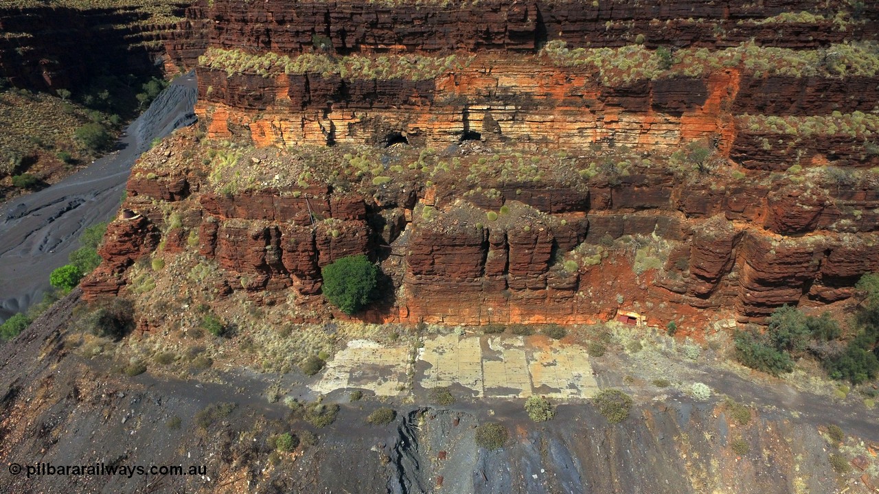 160103 DJI 0070
Colonial Mill and mine ruins located within Wittenoom Gorge. The large concrete area on the upper level is the former mining offices and railway workshops, a sharp eye will see the sealed mine entry with a red door. See images of the site intact [url=http://www.pilbararailways.com.au/gallery/thumbnails.php?album=117] here [/url], 194-08 shows the sealed red entry point. Geodata: [url=https://goo.gl/maps/BD1BiF3pHTr] -22.3112605 118.3190326 [/url].
