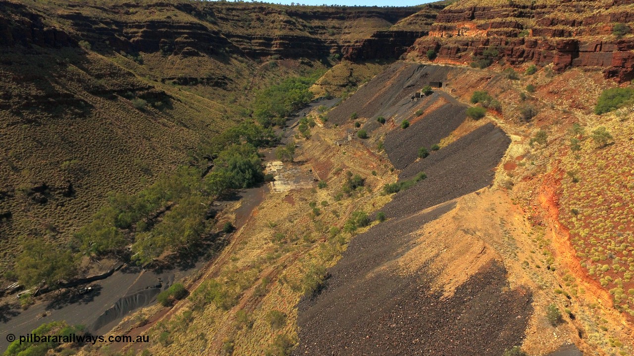 160103 DJI 0072
Colonial Mill and mine ruins located within Wittenoom Gorge. Concrete foundations remain of the once impressive crusher, mill, dryer and bagging plant. See images of the site intact [url=http://www.pilbararailways.com.au/gallery/thumbnails.php?album=118] here [/url]. Geodata: [url=https://goo.gl/maps/D9EB6GYh97z] -22.3090405 118.3190116 [/url].
