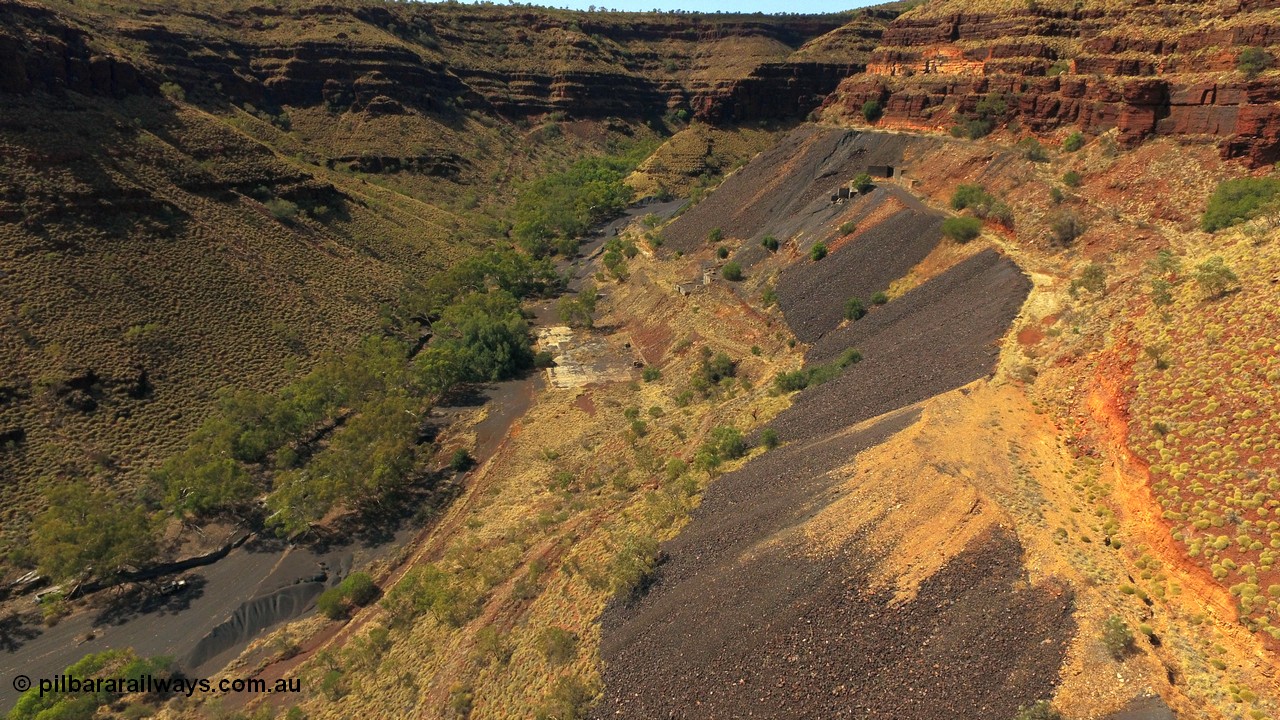 160103 DJI 0073
Colonial Mill and mine ruins located within Wittenoom Gorge. Concrete foundations remain of the once impressive crusher, mill, dryer and bagging plant. See images of the site intact [url=http://www.pilbararailways.com.au/gallery/thumbnails.php?album=118] here [/url]. Geodata: [url=https://goo.gl/maps/D9EB6GYh97z] -22.3090405 118.3190116 [/url].
