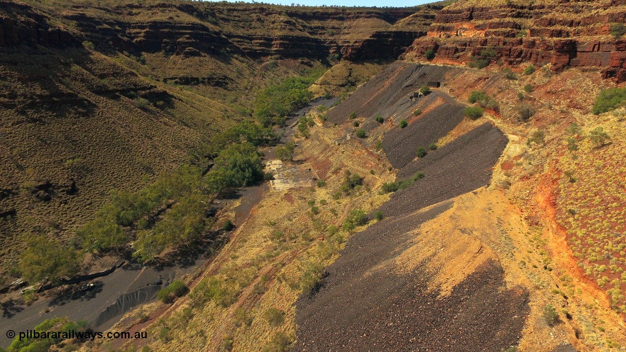 160103 DJI 0074
Colonial Mill and mine ruins located within Wittenoom Gorge. Concrete foundations remain of the once impressive crusher, mill, dryer and bagging plant. See images of the site intact [url=http://www.pilbararailways.com.au/gallery/thumbnails.php?album=118] here [/url]. Geodata: [url=https://goo.gl/maps/D9EB6GYh97z] -22.3090405 118.3190116 [/url].
