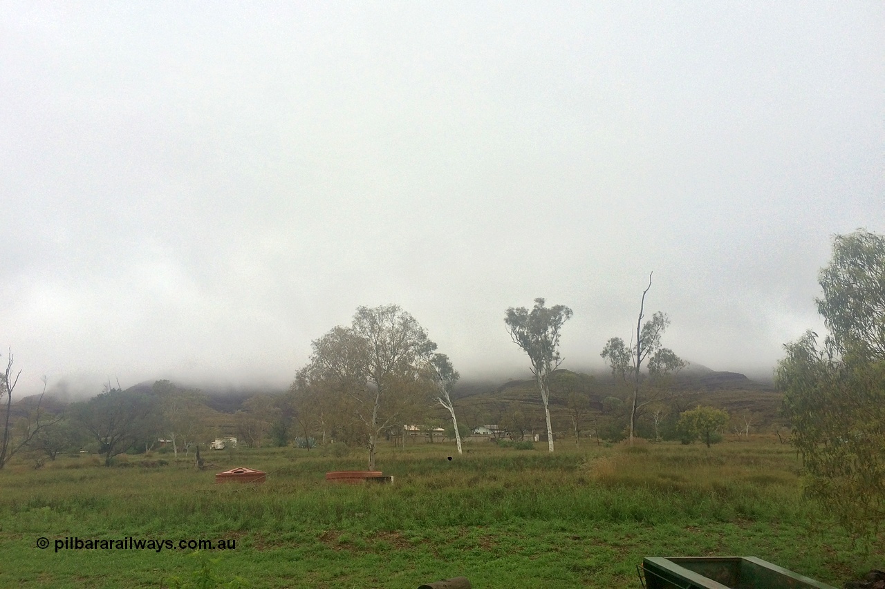 160708 iPh5S 2784
Wittenoom, view looking south at the fog hanging over Mount Watkins and the Hammersley Range from 53 Fifth Avenue Wittenoom, taken at 3:15pm, 8th of July 2016. [url=https://goo.gl/maps/P5sgAQmsSvzDrdTn8]Geodata[/url].
