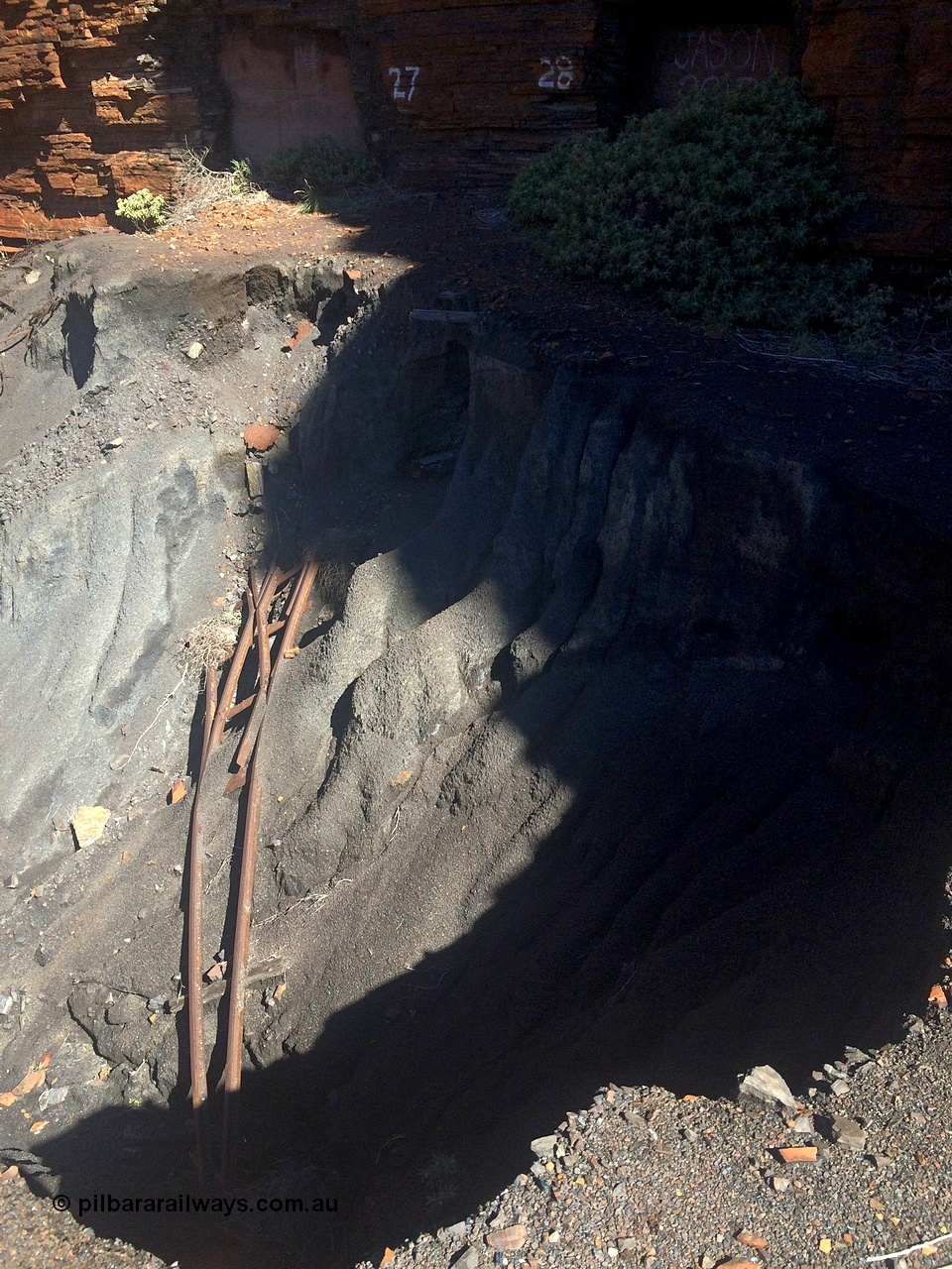 160710 iPh5S 2801
Wittenoom Gorge, Colonial Mine, looking across a tailings slip with a point in the void and adits 27 and 28 across the way.
