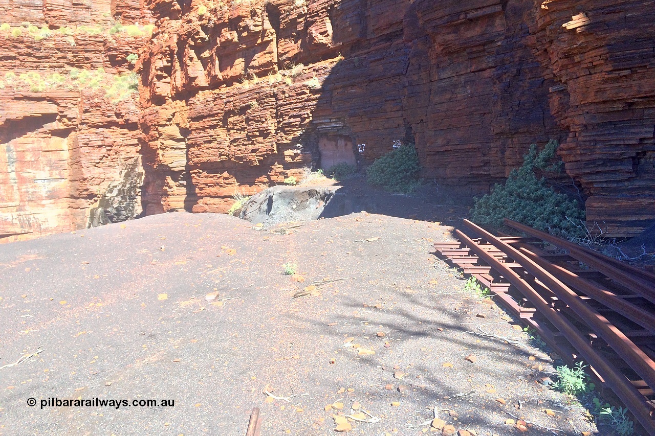 160710 iPh5S 2802
Wittenoom Gorge, Colonial Mine, view looking across the level to adits #28 and #27. Tailings fill has eroded, old track points or switches stacked up. [url=https://goo.gl/maps/maDEBws4ULiH7nWz6]Geodata[/url].
