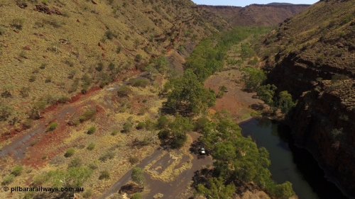 160102 DJI 0039
Wittenoom Gorge, view looking north east over the remains of the footings and slabs of the Gorge Mine location with the drive ramp up the left wall, pool in Joffre Creek on the right. [url=https://goo.gl/maps/KpQRGCBiDbrjskJd9]Geodata[/url].
