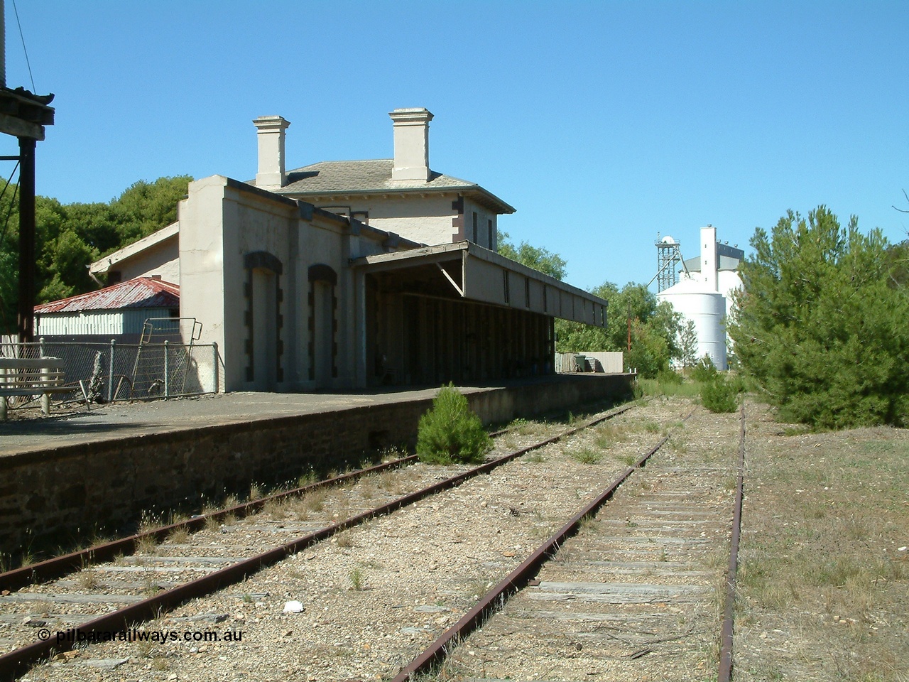 030403 111454
Kapunda railway station building looking south east with silos in the distance.
