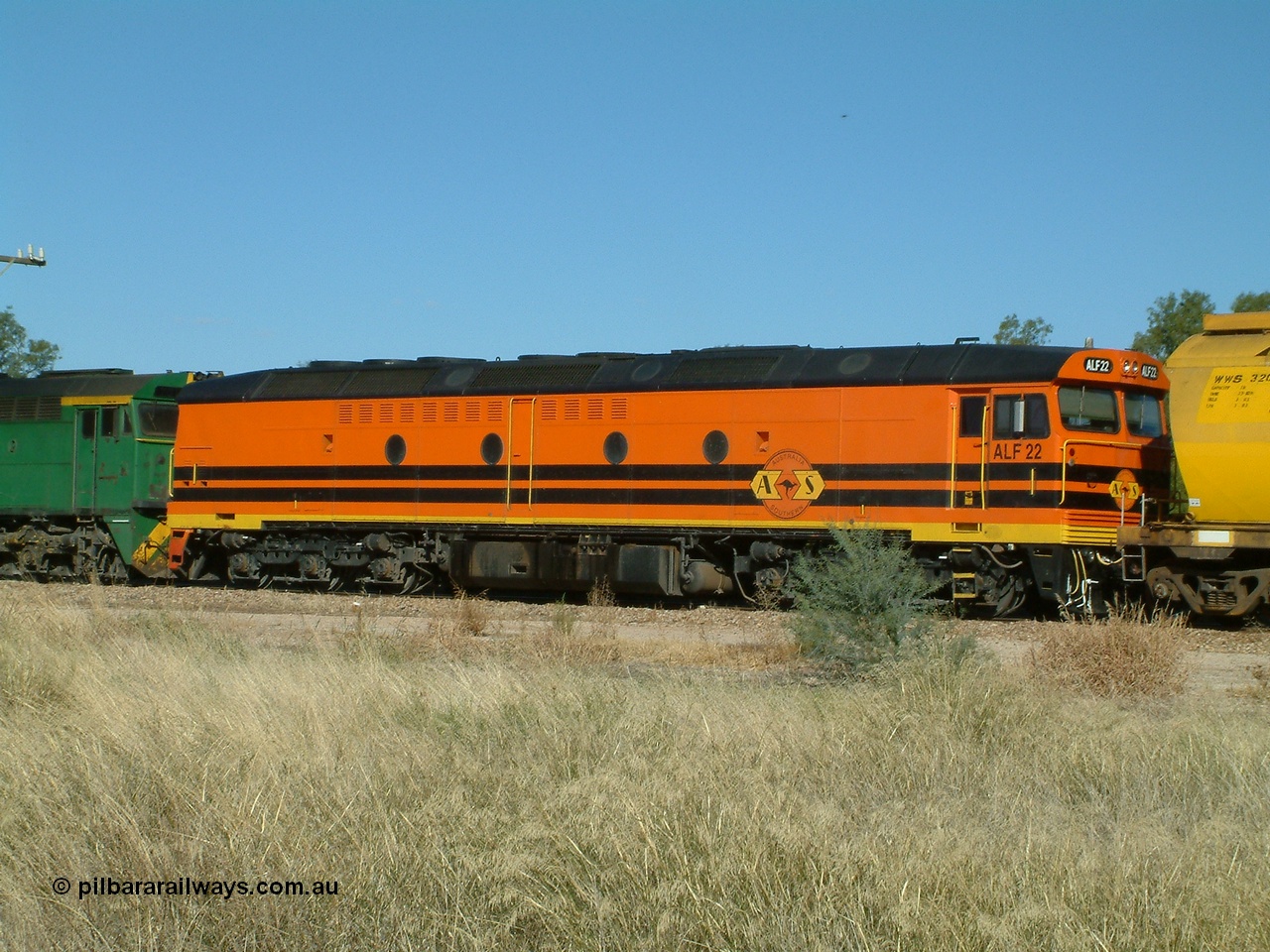 030403 153802
Gladstone, MKA (Morrison Knudsen Australia) rebuilt AL class AL 23 into EMD JT26C-2M model for Australian National in 1993 as the ALF class, here ALF 22 serial 94-AB-022 is second unit on a gradin train being loaded on the 3rd April 2003.
Keywords: ALF-class;ALF22;94-AN-022;MKA;EMD;JT26C-2M;AL-class;