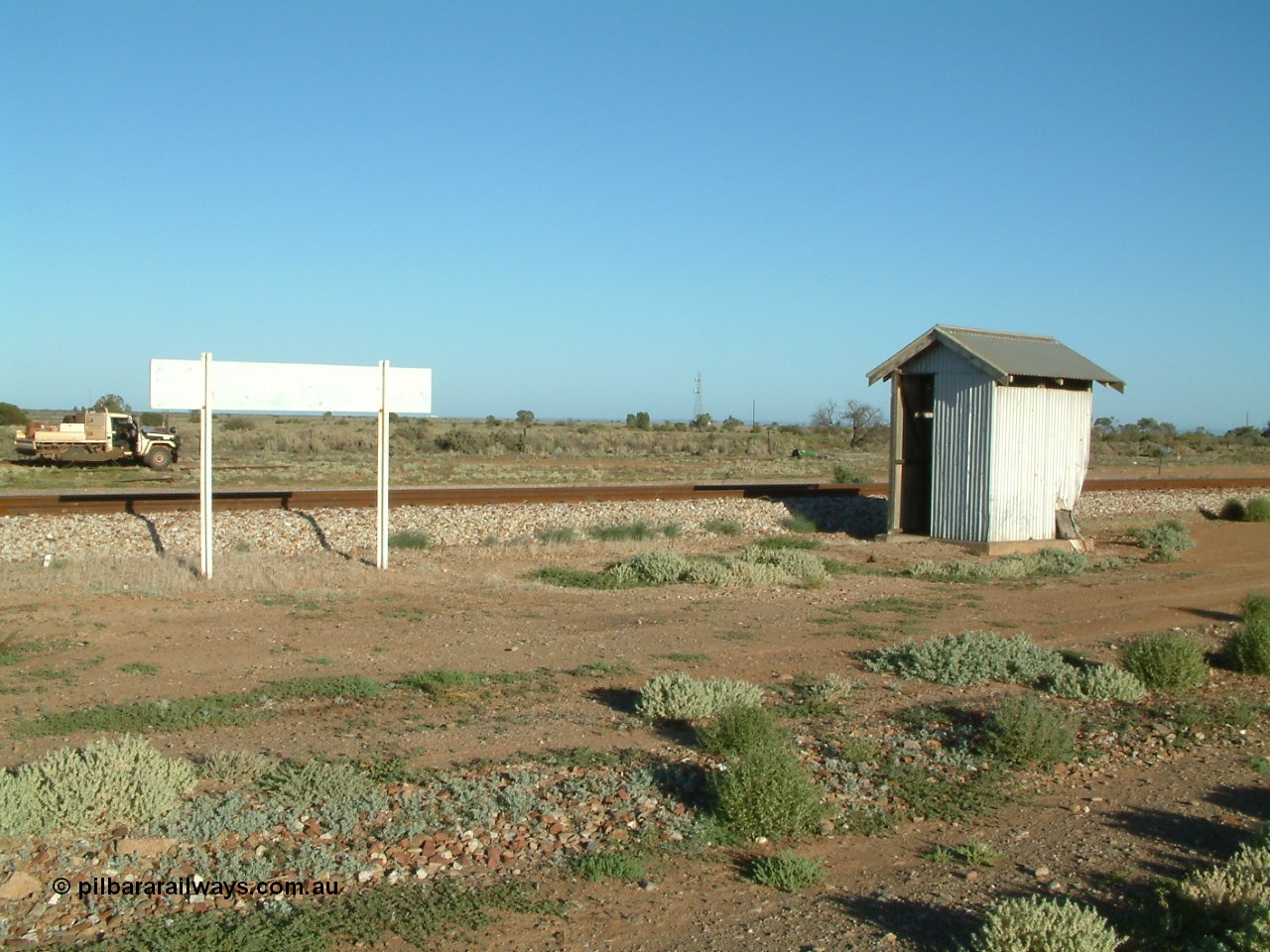 030404 074333
Port Germein, looking from the east side of station with name board and shelter, ute with camp on far side. 4th April 2003.
