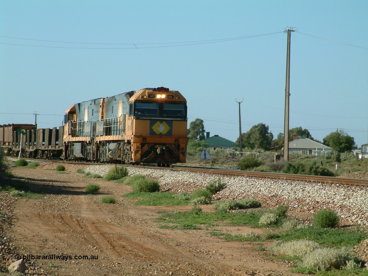 030404 082806
Port Germein, Perth bound steel and intermodal hurries through on the main behind National Rail's Goninan built GE Cv40-9i model NR class units NR 30 serial 7250-06 / 97-236 and a sister unit. 4th April 2003.
Keywords: NR-class;NR34;7250-06/97-236;Goninan;GE;Cv40-9i;