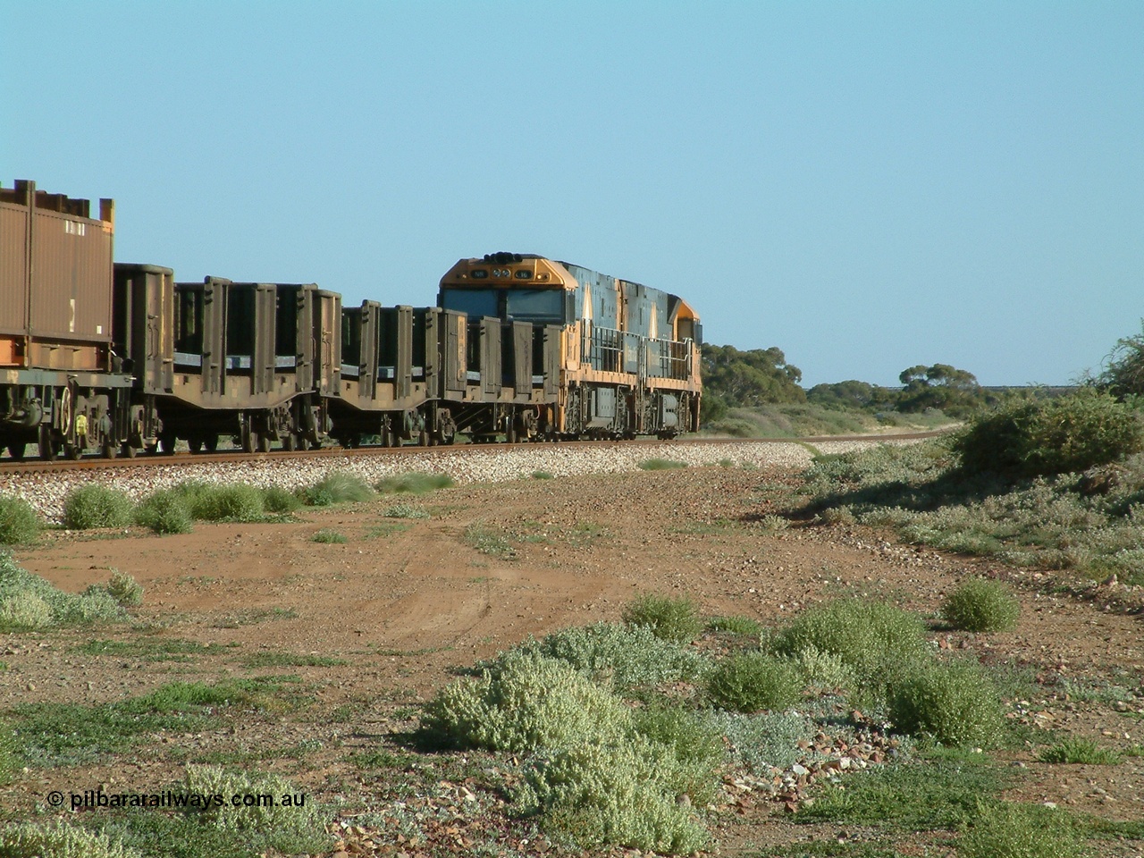 030404 082825
Port Germein, Perth bound steel and intermodal hurries through on the main behind National Rail's Goninan built GE Cv40-9i model NR class units NR 30 serial 7250-06 / 97-236 and a sister unit. 4th April 2003.
