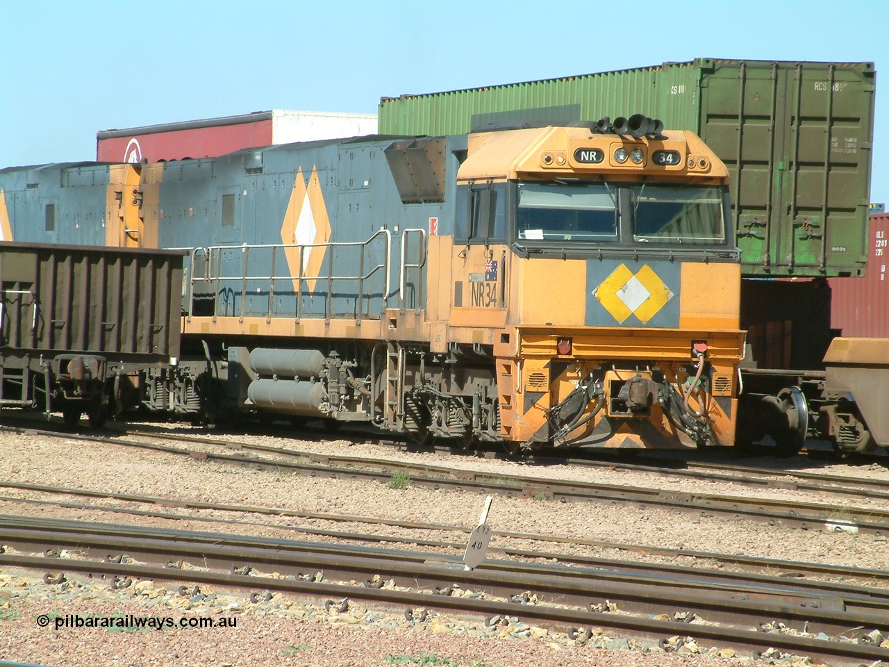 030404 104006
Port Augusta Spencer Junction yard, National Rail Goninan built GE Cv40-9i model NR class unit NR 34 serial 7250-06 / 97-236 sits in the yard in between jobs. 4th April 2003.
Keywords: NR-class;NR34;Goninan;GE;Cv40-9i;7250-06/97-236;