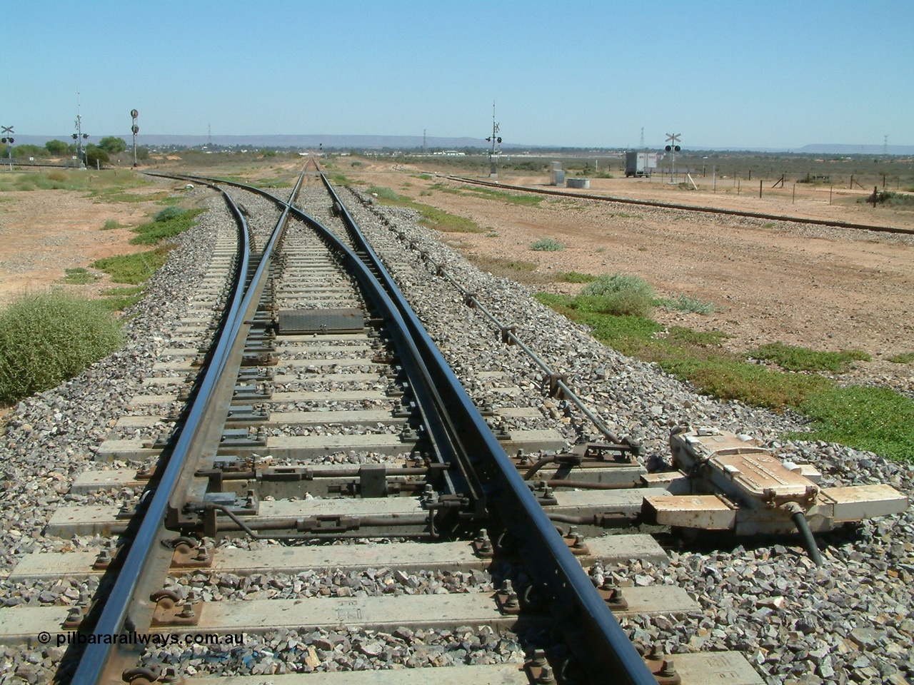 030404 120343
Stirling North, looking west to Port Augusta, line to Port Augusta power station is diverging left, the narrow gauge line for Pichi Richi Railway is on the far right.
