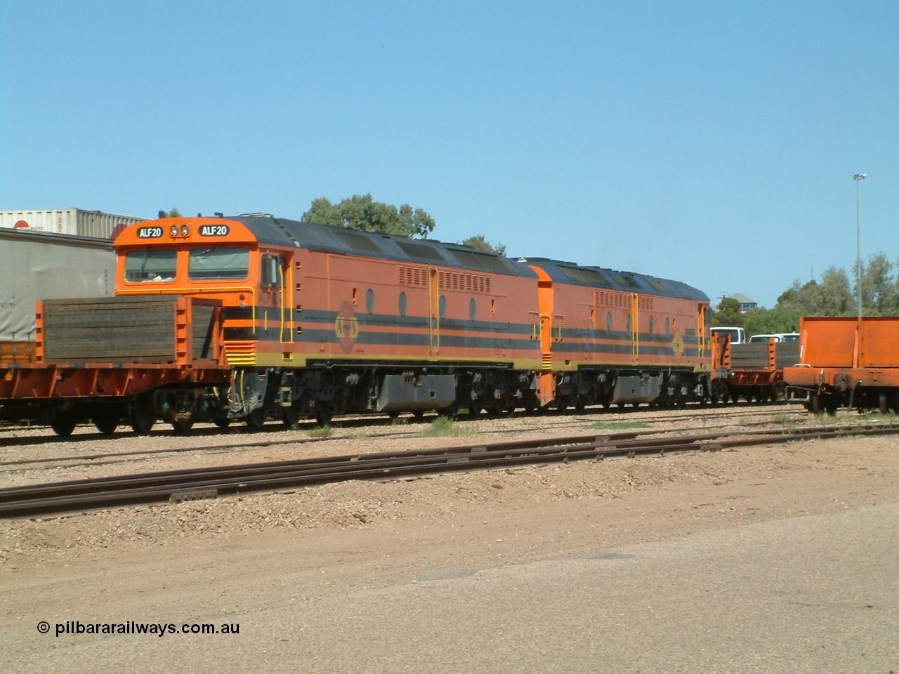 030404 131042
Port Augusta Spencer Junction yard, MKA (Morrison Knudsen Australia) rebuilt AL class AL 24 into EMD JT26C-2M model for Australian National in 1993 as the ALF class, here ALF 20 serial 94-AB-020 shunts empty rail transport waggon sets from the Darwin construction. 4th April, 2003.
Keywords: ALF-class;ALF20;MKA;EMD;JT26C-2M;94-AN-020;rebuild;AL-class;AL24;Clyde-Engineering;EMD;JT26C;76-840;