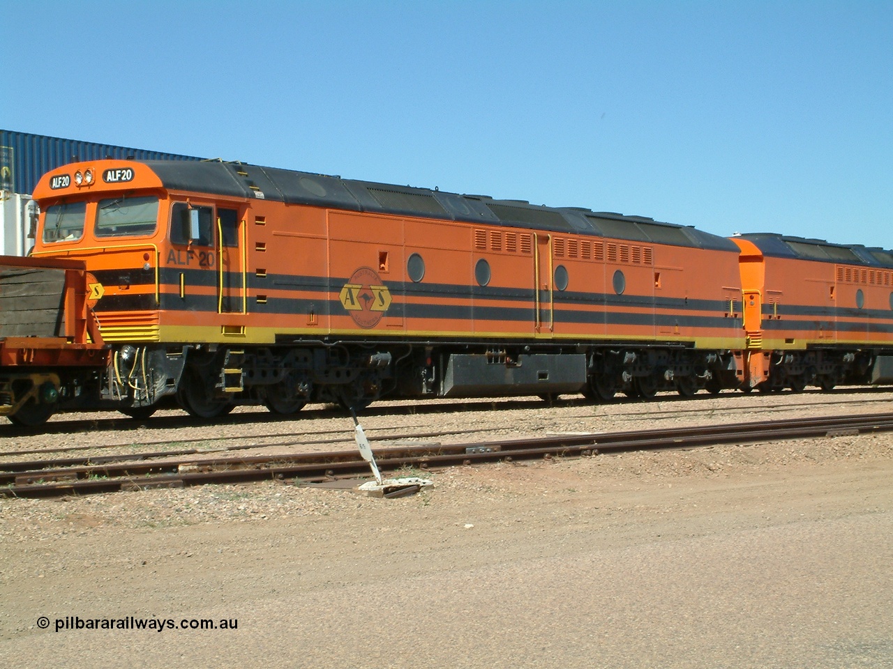 030404 131049
Port Augusta Spencer Junction yard, MKA (Morrison Knudsen Australia) rebuilt AL class AL 24 into EMD JT26C-2M model for Australian National in 1993 as the ALF class, here ALF 20 serial 94-AB-020 shunts empty rail transport waggon sets from the Darwin construction. 4th April, 2003.
Keywords: ALF-class;ALF20;94-AN-020;MKA;EMD;JT26C-2M;AL-class;