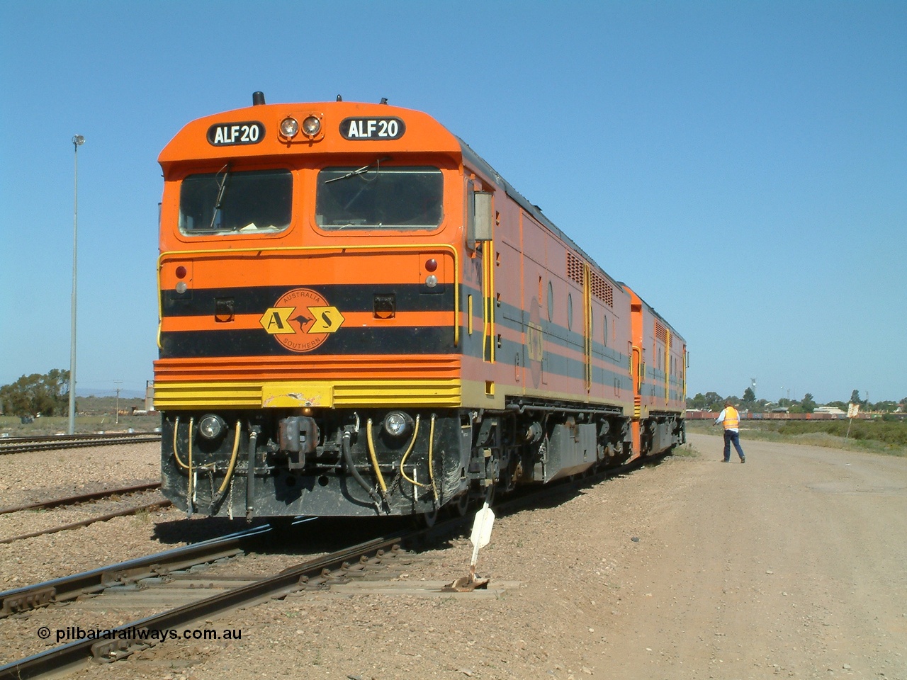 030404 141115
Port Augusta Spencer Junction yard, MKA (Morrison Knudsen Australia) rebuilt AL class AL 24 into EMD JT26C-2M model for Australian National in 1993 as the ALF class, here ALF 20 serial 94-AB-020 shunts empty rail transport waggon sets from the Darwin construction. 4th April, 2003.
Keywords: ALF-class;ALF20;94-AN-020;MKA;EMD;JT26C-2M;AL-class;