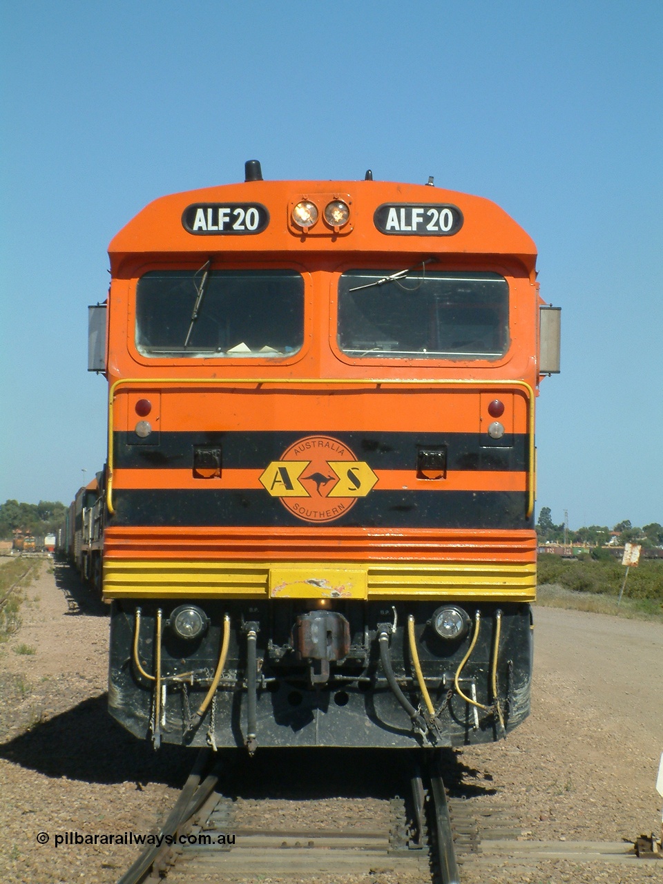 030404 141132
Port Augusta Spencer Junction yard, MKA (Morrison Knudsen Australia) rebuilt AL class AL 24 into EMD JT26C-2M model for Australian National in 1993 as the ALF class, here ALF 20 serial 94-AB-020 shunts empty rail transport waggon sets from the Darwin construction. 4th April, 2003.
Keywords: ALF-class;ALF20;94-AN-020;MKA;EMD;JT26C-2M;AL-class;