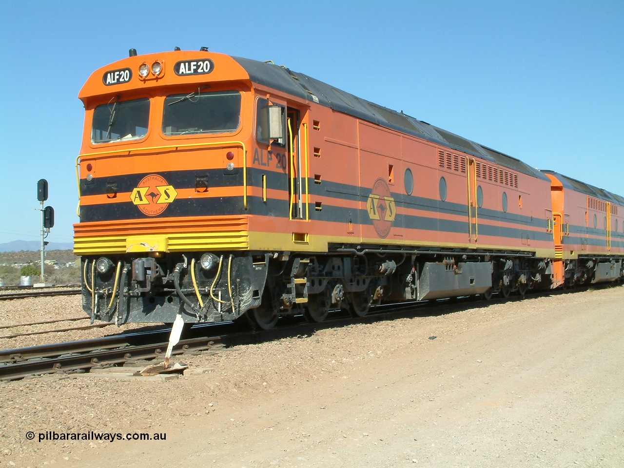 030404 141224
Port Augusta Spencer Junction yard, MKA (Morrison Knudsen Australia) rebuilt AL class AL 24 into EMD JT26C-2M model for Australian National in 1993 as the ALF class, here ALF 20 serial 94-AB-020 shunts empty rail transport waggon sets from the Darwin construction. 4th April, 2003.
Keywords: ALF-class;ALF20;MKA;EMD;JT26C-2M;94-AN-020;rebuild;AL-class;AL24;Clyde-Engineering;EMD;JT26C;76-840;