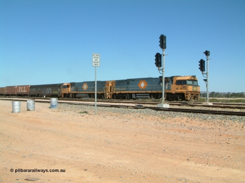 030404 125017
Port Augusta Spencer Junction yard, a Perth bound intermodal awaits departure time on 13 Road behind National Rail NR class units built by Goninan as GE Cv40-9i models, NR 50 serial 7250-08 / 97-252 and NR 37 serial 7250-06 / 97-239. 4th April 2003.
Keywords: NR-class;NR50;Goninan;GE;Cv40-9i;7250-08/97-252;