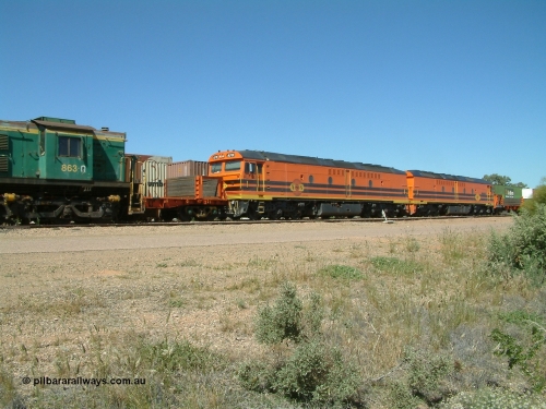 030404 131855
Port Augusta Spencer Junction yard, MKA (Morrison Knudsen Australia) rebuilt AL class AL 24 into EMD JT26C-2M model for Australian National in 1993 as the ALF class, here ALF 20 serial 94-AB-020 shunts empty rail transport waggon sets from the Darwin construction. 4th April, 2003.
Keywords: ALF-class;ALF20;MKA;EMD;JT26C-2M;94-AN-020;rebuild;AL-class;AL24;Clyde-Engineering;EMD;JT26C;76-840;