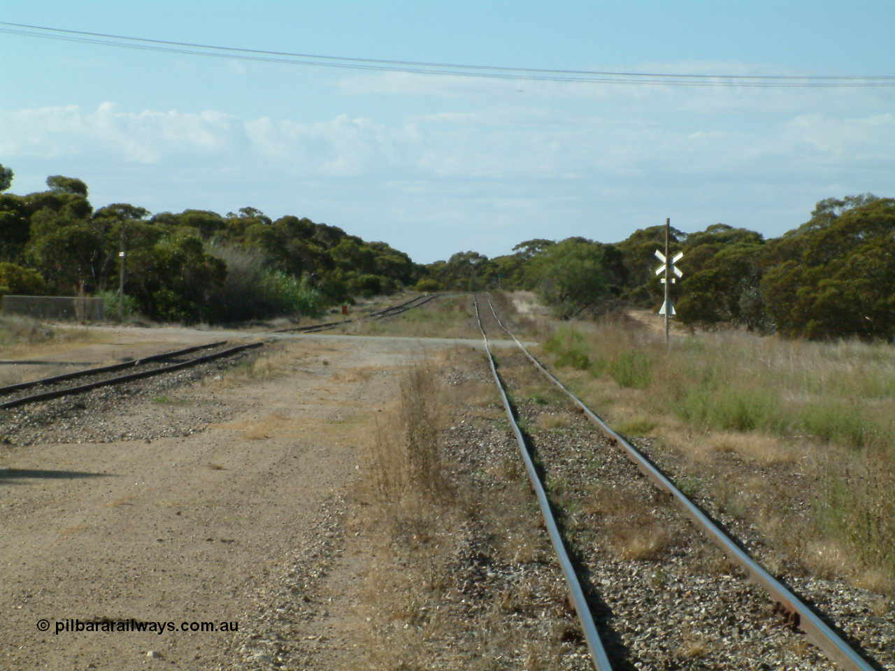 030405 155314
Lock, yard view looking north across the grade crossing for Pilkagee Rd, 5th April 2003.
