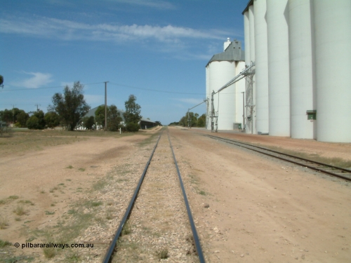 030405 133308
Wudinna, yard view looking along the mainline south with grain shed on the left and silo complexes and loading spouts on the right, old station site on the left, April 5, 2003.
