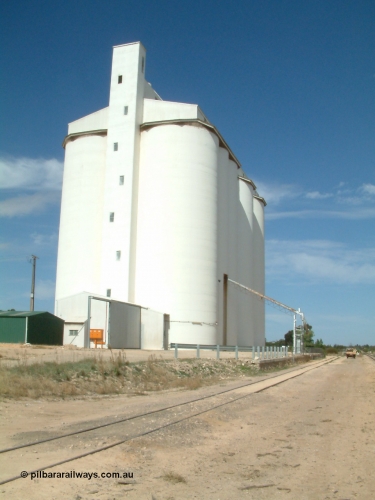 030405 140314
Kyancutta, yard view of concrete silo complex for SACBH and outflow spout, looking south, April 5, 2003.
