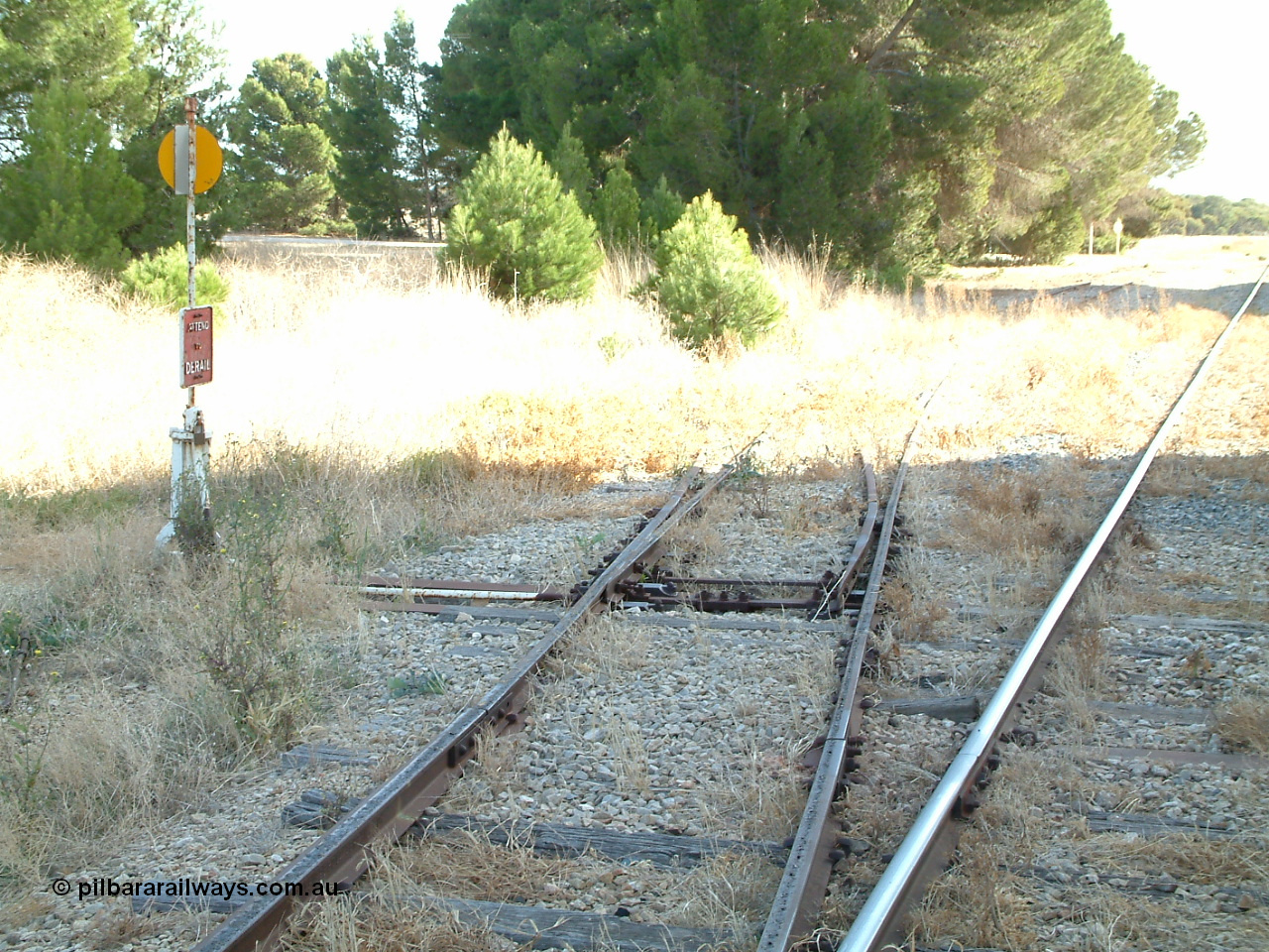 030406 092406
Yeelanna, yard view of the station siding looking north with the points, lever and indicator for the south leg of the triangle and line curving away to the left visible. 6th April 2003.
