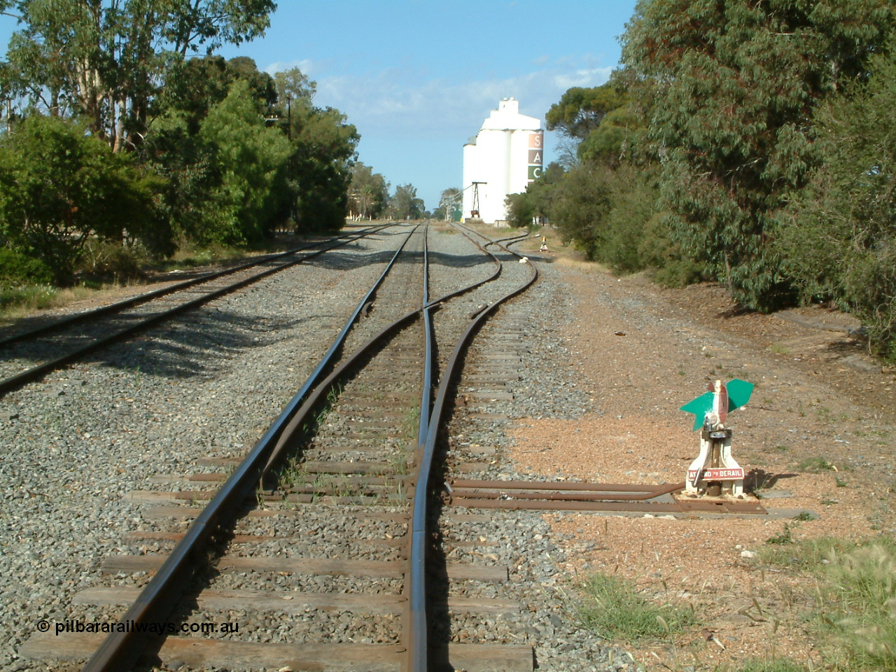 030406 094438
Cummins, yard view looking south along the mainline with the points, lever and indicator for the grain siding, then the same for the goods loading ramp, the Buckleboo line - siding is on the left. 6th April 2003.
