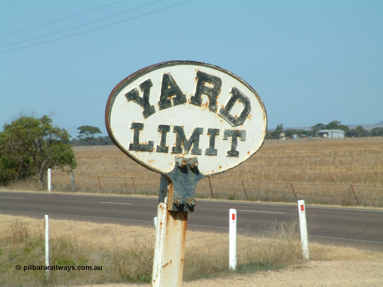 030406 101336
Cummins, original cast iron YARD LIMIT sign bolted to a rail post. 6th April 2003.
