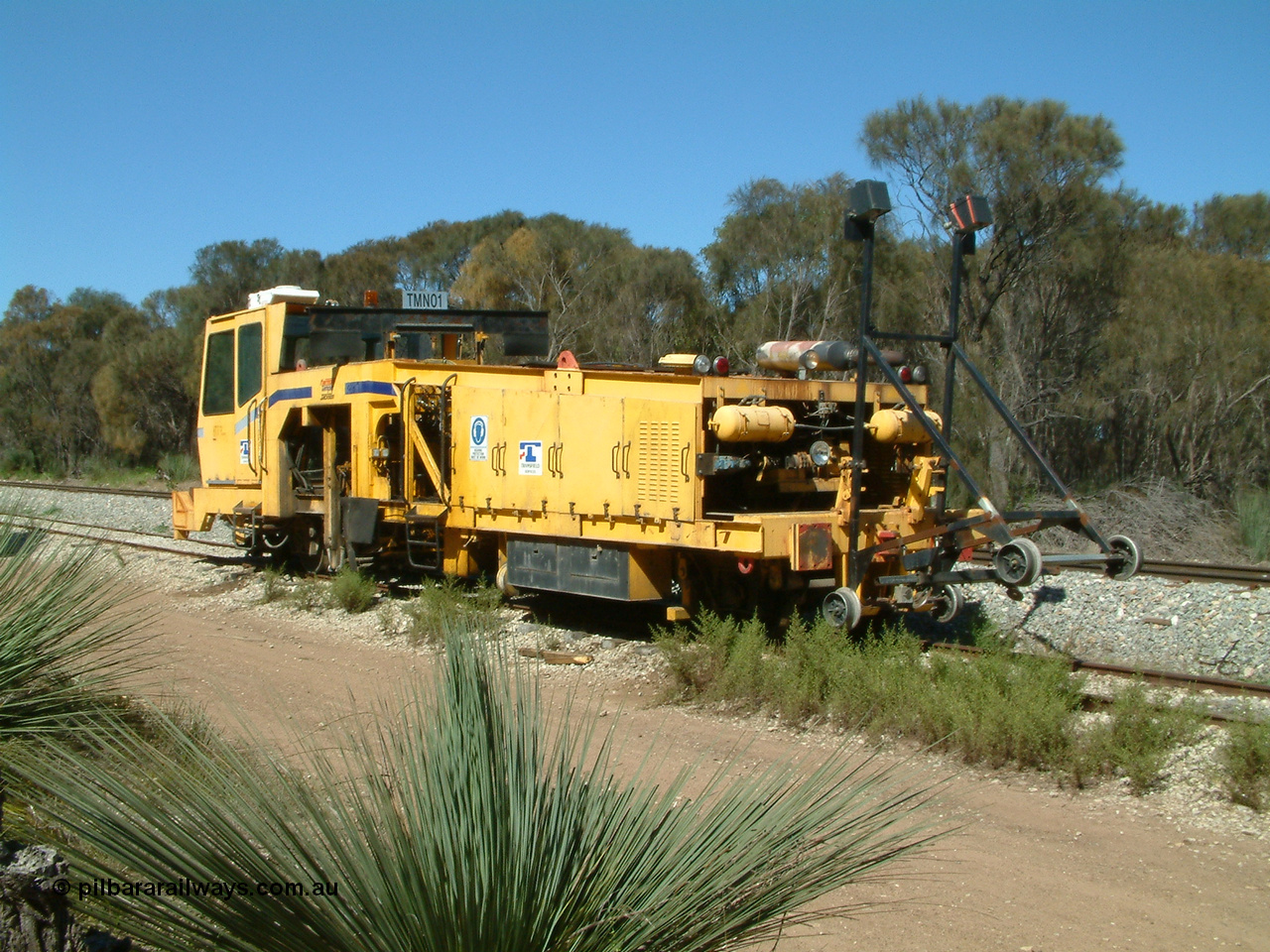 030406 110734
Coomunga, on the siding, Transfield track machine TMN 01 which is a track tamper. 6th April 2003.
Keywords: track-machine;