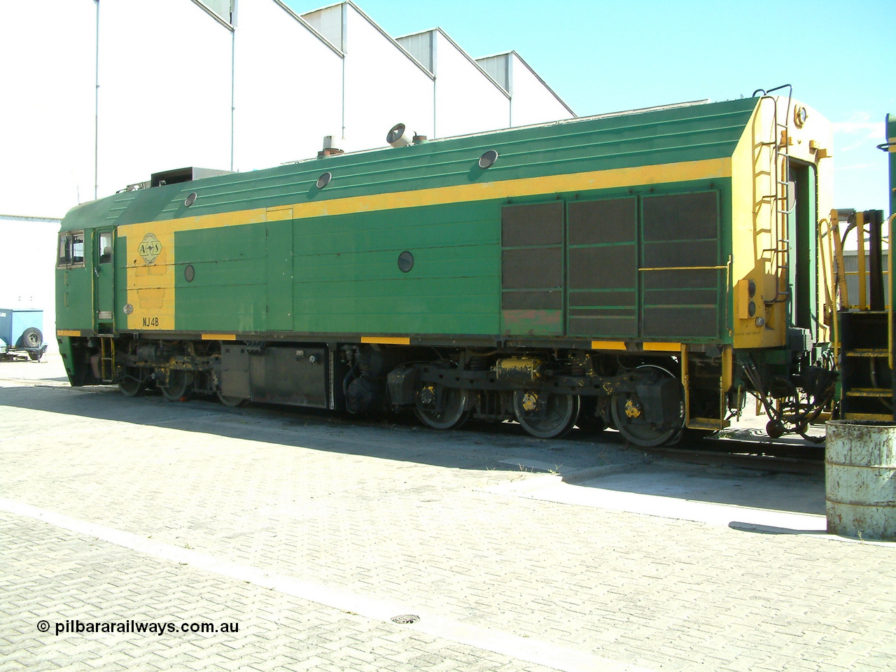 030406 114054
Port Lincoln loco workshops, still wearing the former owner's AN livery, Australian Southern locomotive and NJ class NJ 4, Clyde Engineering EMD model JL22C serial 71-731, no. 2 end roster view showing rear door and roof access ladder. 6th April 2003.
Keywords: NJ-class;NJ4;71-731;Clyde-Engineering-Granville-NSW;EMD;JL22C;