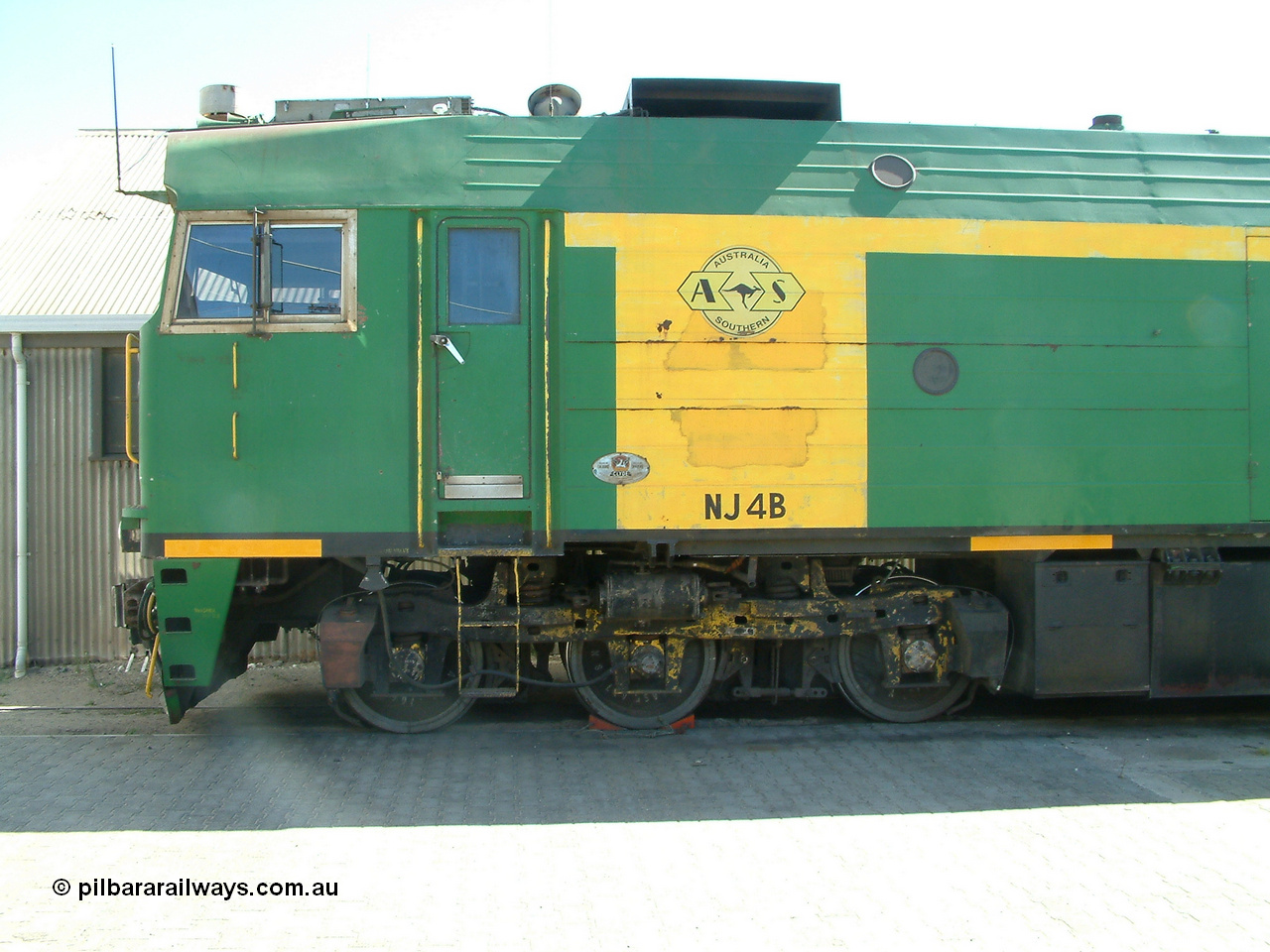 030406 114122
Port Lincoln loco workshops, still wearing the former owner's AN livery, Australian Southern locomotive and NJ class NJ 4, Clyde Engineering EMD model JL22C serial 71-731, cab side view with check letter B. 6th April 2003.
Keywords: NJ-class;NJ4;71-731;Clyde-Engineering-Granville-NSW;EMD;JL22C;