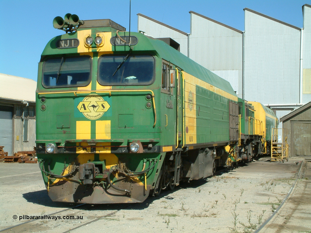 030406 114342
Port Lincoln loco workshops, still wearing the former owner's AN livery, Australian Southern locomotive and NJ class leader NJ 1 'Ben Chifley' Clyde Engineering EMD model JL22C serial 71-728, in multiple unit consist, roster shot. 6th April 2003.
Keywords: NJ-class;NJ1;71-728;Clyde-Engineering-Granville-NSW;EMD;JL22C;