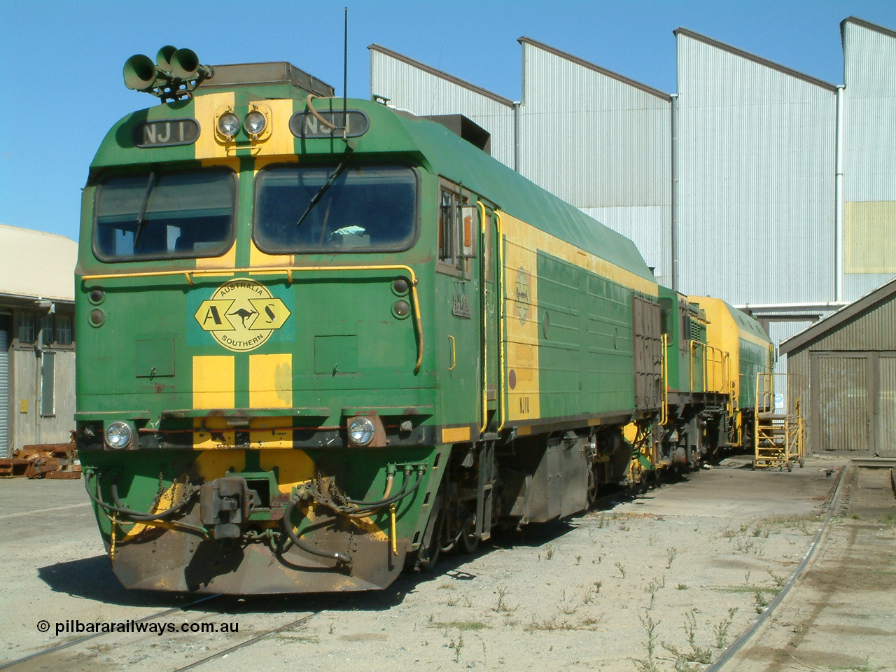 030406 114350
Port Lincoln loco workshops, still wearing the former owner's AN livery, Australian Southern locomotive and NJ class leader NJ 1 'Ben Chifley' Clyde Engineering EMD model JL22C serial 71-728, in multiple unit consist, roster shot. 6th April 2003.
Keywords: NJ-class;NJ1;71-728;Clyde-Engineering-Granville-NSW;EMD;JL22C;