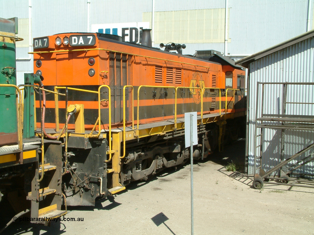 030406 114756
Port Lincoln loco workshops, wearing Australian Southern livery rebuild ALCo locomotive unit DA 7 started life as NSWGR 48 class 4813 AE Goodwin ALCo model DL531 serial 83713, rebuilt by Islington Workshops with long hood and parts from former 830 class 870 AE Goodwin ALCo model DL531 serial G6016-06 in 1998. B end roster view looking forward. 6th April 2003.
Keywords: DA-class;DA7;83713;Port-Augusta-WS;ALCo;DL531G/1;48-class;4813;rebuild;