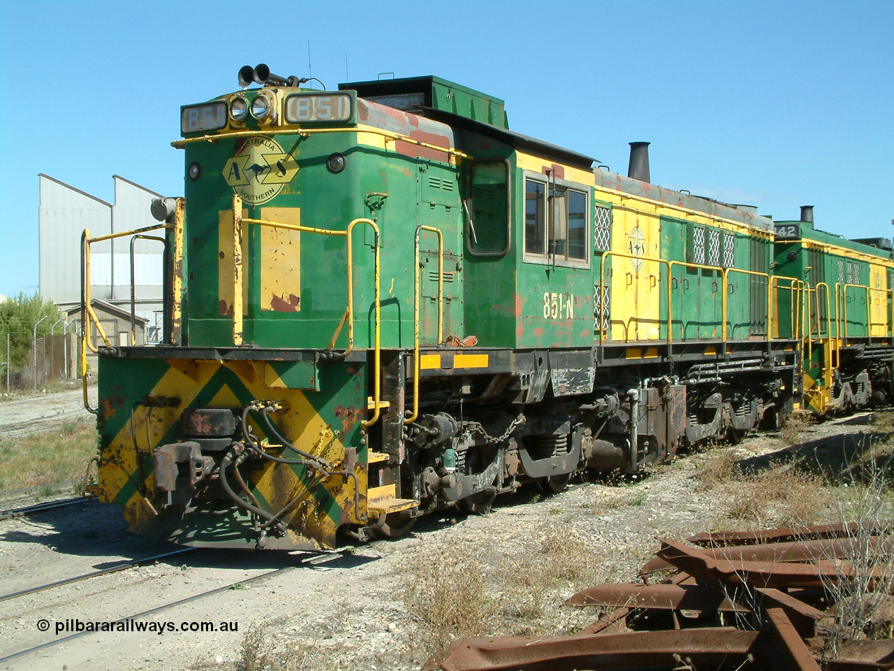 030406 115400
Port Lincoln loco workshops, still in former owner AN livery, Australian Southern 830 class locomotive 851 AE Goodwin ALCo model DL531 serial 84137 which has been on the Eyre Peninsula Division since being built in April 1962, roster shot coupled to sister unit. 6th April 2003.
Keywords: 830-class;851;84137;AE-Goodwin;ALCo;DL531;