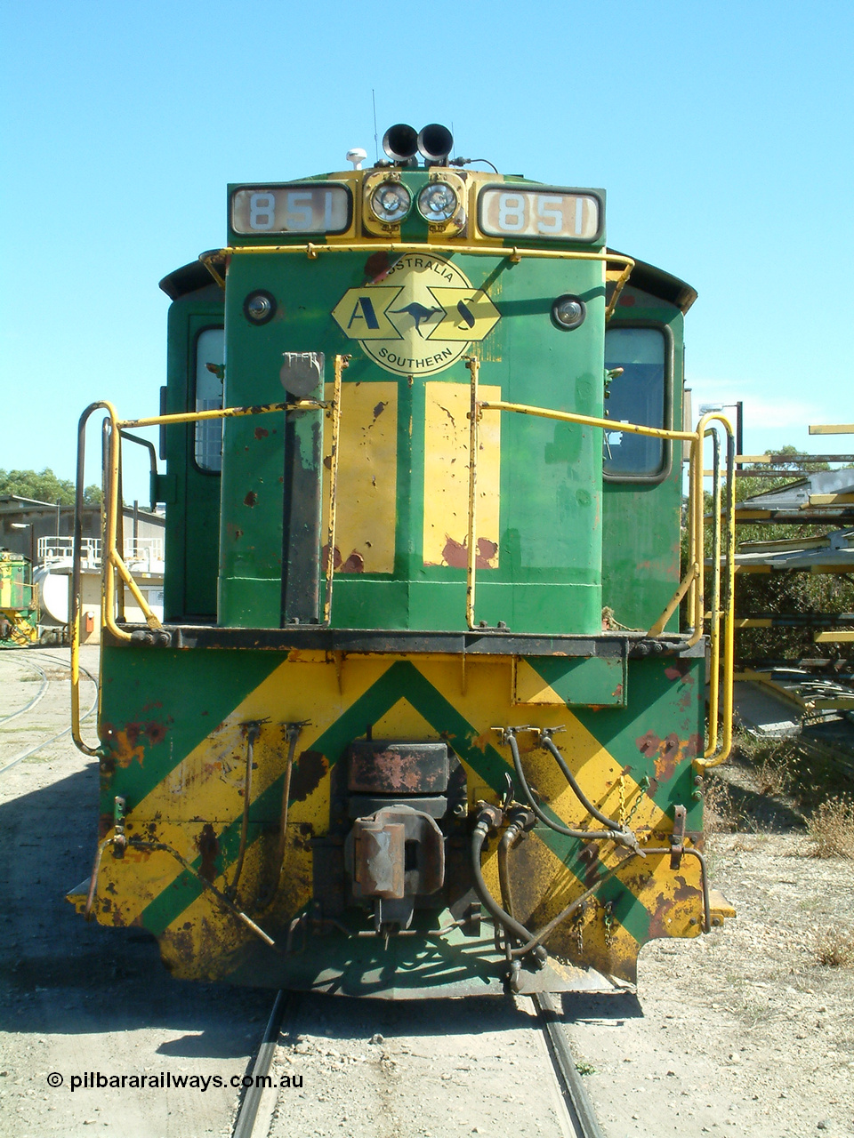 030406 115438
Port Lincoln loco workshops, still in former owner AN livery, Australian Southern 830 class locomotive 851 AE Goodwin ALCo model DL531 serial 84137 which has been on the Eyre Peninsula Division since being built in April 1962, cab front view. 6th April 2003.
Keywords: 830-class;851;84137;AE-Goodwin;ALCo;DL531;