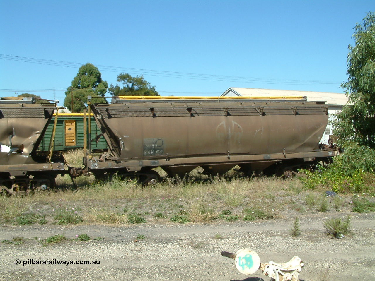 030406 115540
Port Lincoln, derailment damaged SAR Islington Workshops built HAN type bogie wheat waggon, HAN 6, stored at the workshops yards. 6th April 2003.
Keywords: HAN-type;HAN6;1969-73/68-6;SAR-Islington-WS;