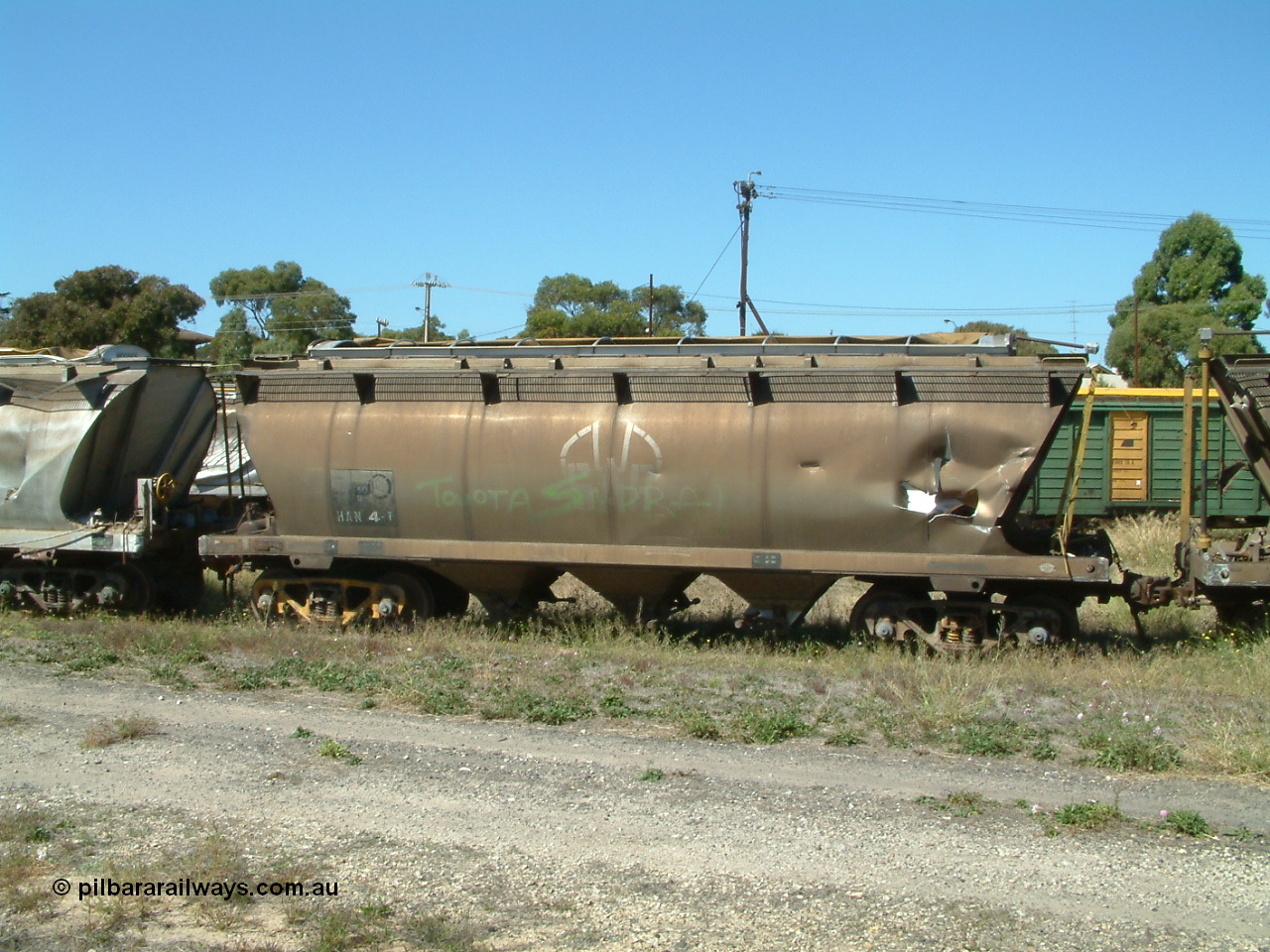 030406 115544
Port Lincoln, derailment damaged SAR Islington Workshops built HAN type bogie wheat waggon HAN 4, stored at the workshops yards. 6th April 2003.
Keywords: HAN-type;HAN4;1969-73/68-4;SAR-Islington-WS;