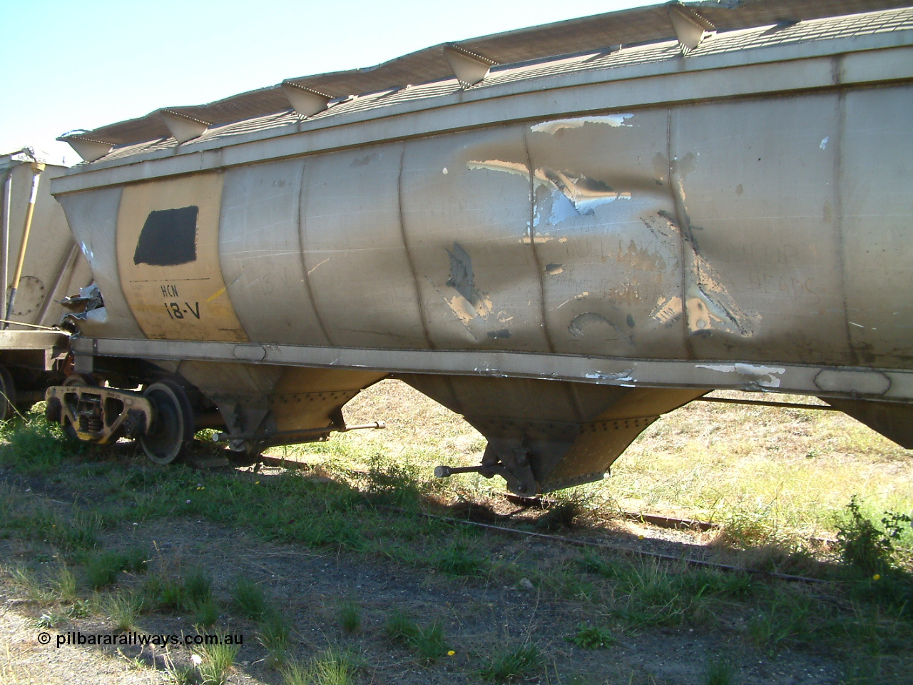 030406 115702
Port Lincoln, derailment damaged HCN type bogie wheat waggon HCN 18, modified at Islington Workshops in 1978-80 which started life as a Tulloch built NHB type iron ore hopper for the CR on the North Australia Railway in 1968-69. It was scrapped in May 2003, not long after this image was taken. 6th April 2003.
Keywords: HCN-type;HCN18;SAR-Islington-WS;rebuild;Tulloch-Ltd-NSW;NHB-type;NHB1010;