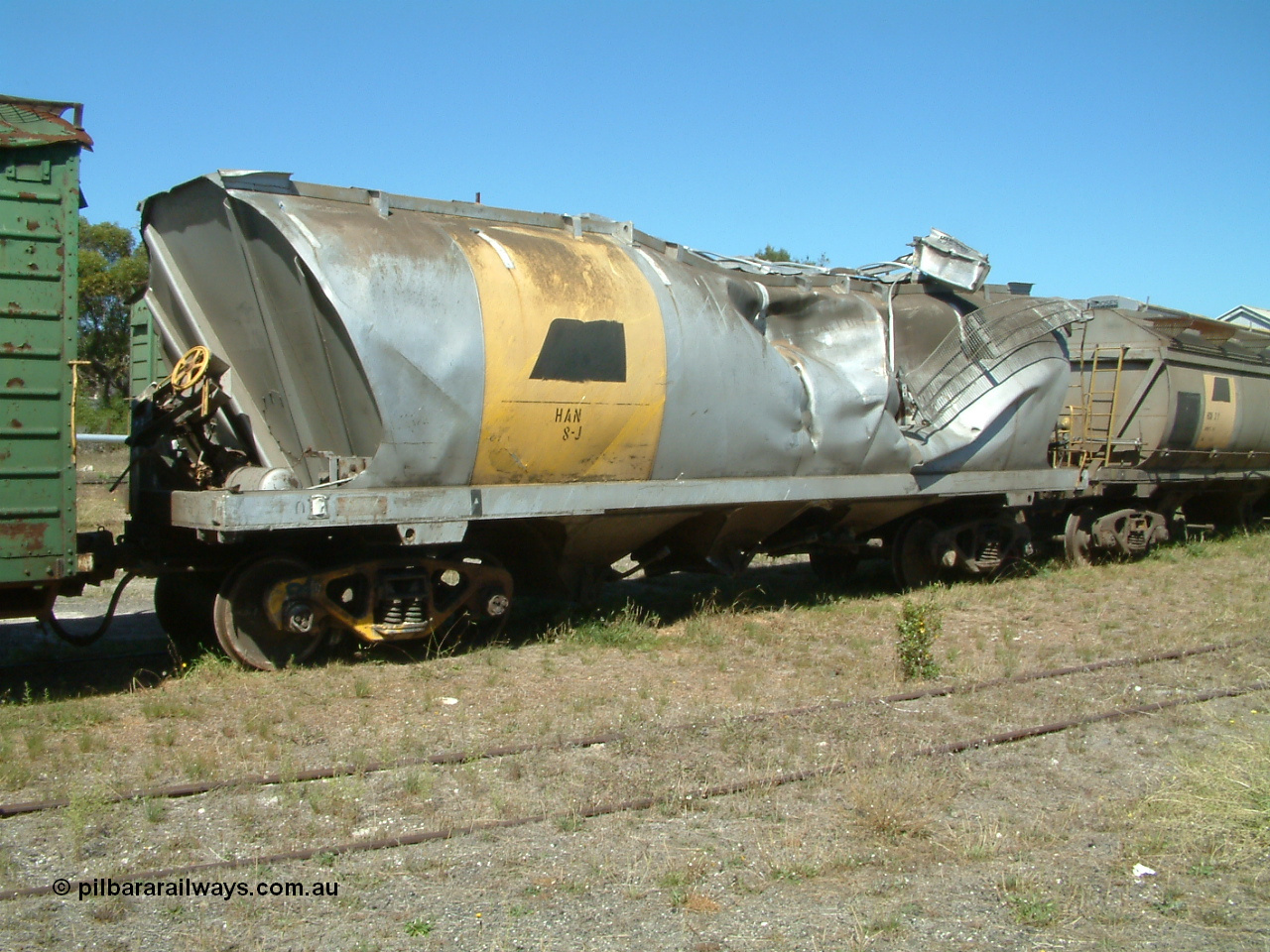 030406 115732
Port Lincoln, derailment damaged SAR Islington Workshops built HAN type bogie wheat waggon HAN 8, stored at the workshops yards. 6th April 2003.
Keywords: HAN-type;HAN8;1969-73/68-8;SAR-Islington-WS;