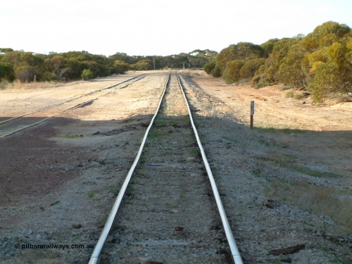 030406 082620
Murdinga, station located at the 128.2 km, originally opened December 1935 and originally referred to as Corunna, front elevation view of train control cabin and waiting room - shelter with station name board, April 6, 2003.
