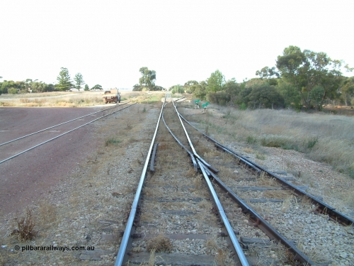 030406 092548
Yeelanna, yard view looking south along the mainline, with points and converging track from the station siding visible on the right, and the points, lever and indicator for the diverging line to Kapinnie and former Mount Hope branch curving to the right. April 6, 2003.
