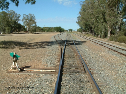 030406 100148
Cummins, track view looking south along the mainline, points, indicator and lever for the grain bunker loading - unloading site which is behind the trees to the left, goods and grain siding on the right. April 6, 2003.
