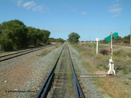 030406 100404
Cummins, track view looking south, points, lever and indicator for the goods and grain siding, on the left the grain bunker loading - unloading site track can be seen curving away to the left. The Todd Highway is at the far right. April 6, 2003.
