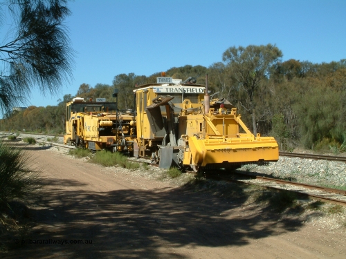 030406 110700
Coomunga, on the siding, two Transfield track machines, TMN 02, a ballast regulator and a track tamper. April 6, 2003.
Keywords: track-machine;