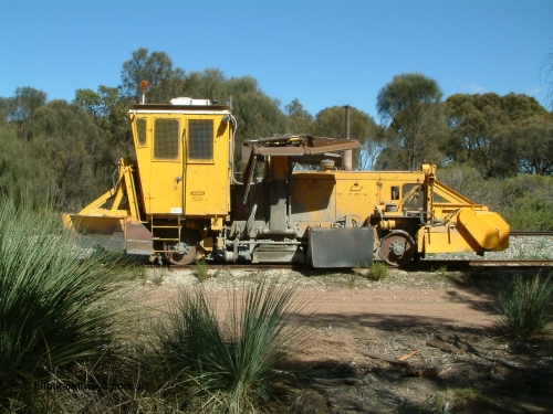 030406 110810
Coomunga, stabled on the siding, Transfield track machine ballast regulator. April 6, 2003.
Keywords: track-machine;
