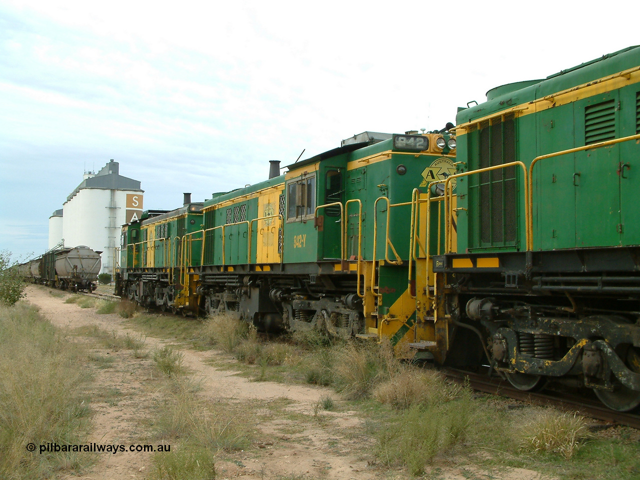 030407 083408
Wudinna, empty grain train shunts back onto train, former Australian National Co-Co locomotives AE Goodwin ALCo model DL531 830 class units 842, serial no. 84140 and 851 serial no. 84137, 851 having been on the Eyre Peninsula since delivered in 1962. 7th April, 2003.
Keywords: 830-class;842;84140;AE-Goodwin;ALCo;DL531;