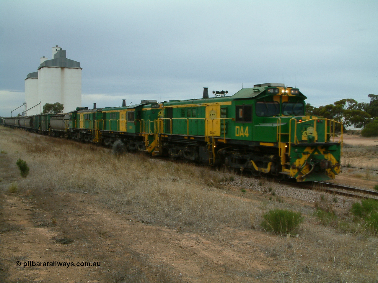 030407 092829
Yaninee, empty grain train behind a trio of former Australian National Co-Co locomotives with rebuilt former AE Goodwin ALCo model DL531 830 class ex 839, serial no. 83730, rebuilt by Port Augusta Workshops to DA class, leading two AE Goodwin ALCo model DL531 830 class units 842, serial no. 84140 and 851 serial no. 84137, 851 having been on the Eyre Peninsula since delivered in 1962, run through express on the mainline. 7th April, 2003.
Keywords: DA-class;DA4;83730;Port-Augusta-WS;ALCo;DL531G/1;830-class;839;rebuild;